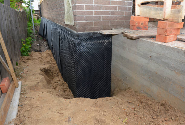 Happy homeowners after waterproofing job in Forest Hill